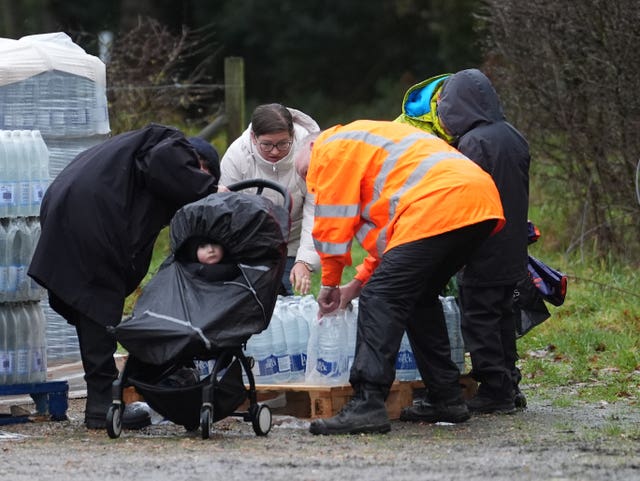 People collect bottled water