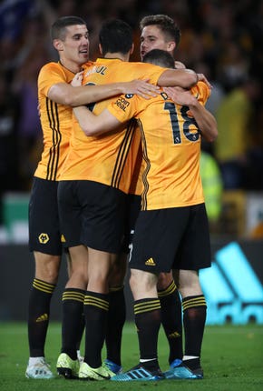 Wolves celebrate Leander Dendoncker's winning goal