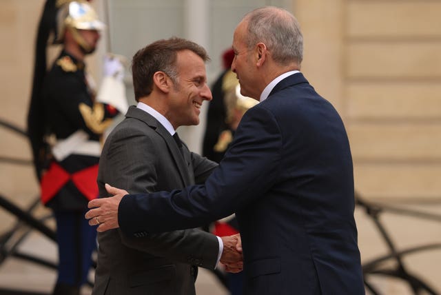 Micheal Martin and Emmanuel Macron embrace