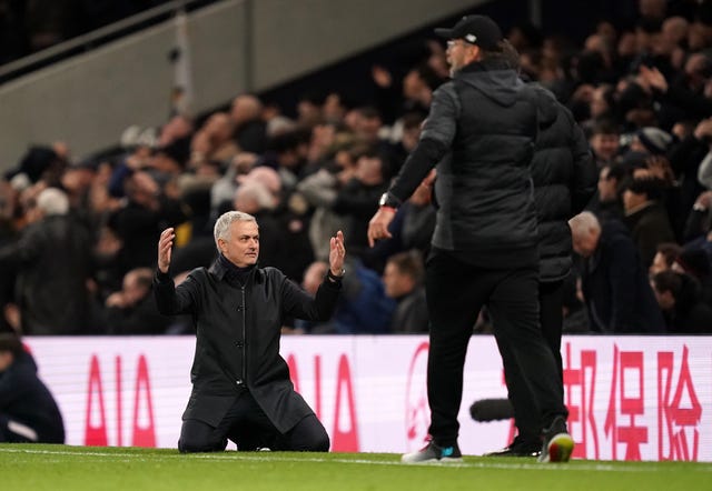Tottenham Hotspur manager Jose Mourinho sinks to his knees on the touchline as rivals Liverpool maintain their unbeaten Premier League run with a 1-0 victory 