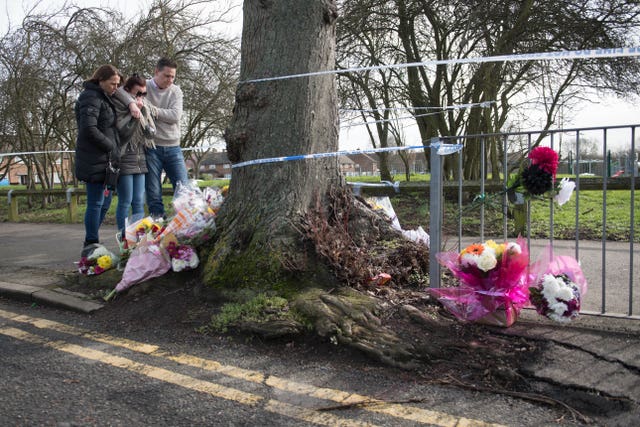 Flowers near the scene in St Neot’s Road in Harold Hill, east London
