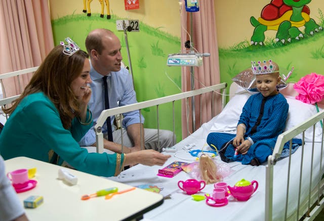 The Duke and Duchess of Cambridge with seven-year-old cancer patient Wafia Remain