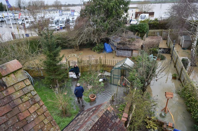 People checking water levels in their back gardens