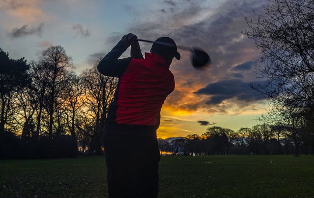 A golfer tees off at Allerton Manor Golf Club in Liverpool
