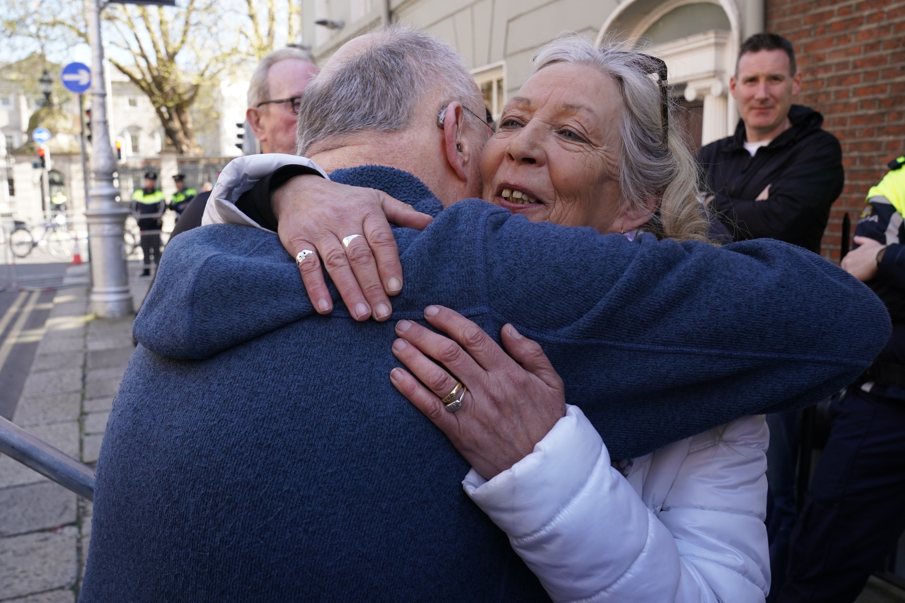 Stardust fire survivor Antoinette Keegan is embraced by Christy Moore after he performed at the national demonstration in of Palestine (Brian Lawless/PA)