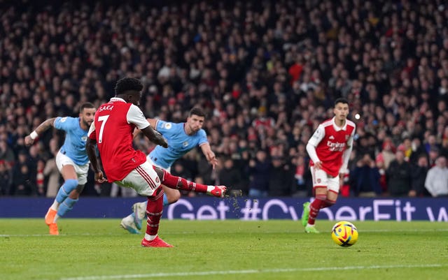 Bukayo Saka scores for Arsenal from the penalty spot
