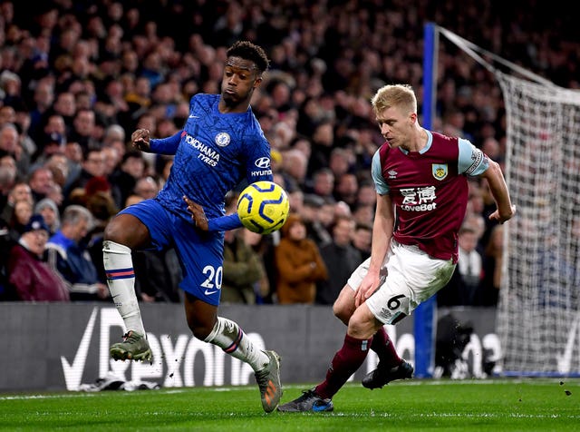 Chelsea’s Callum Hudson-Odoi and Burnley’s Ben Mee battle for the ball 