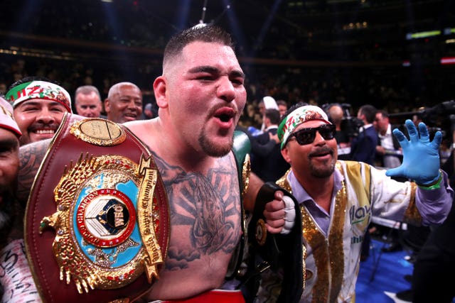 Andy Ruiz Jr celebrates with his title belts after beating Anthony Joshua
