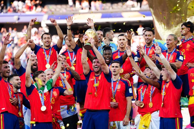 Spain celebrate with the World Cup trophy