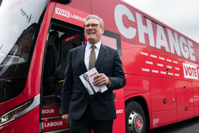 Labour Party leader Sir Keir Starmer arrives on board his election battle bus at a campaign event in Halesowen