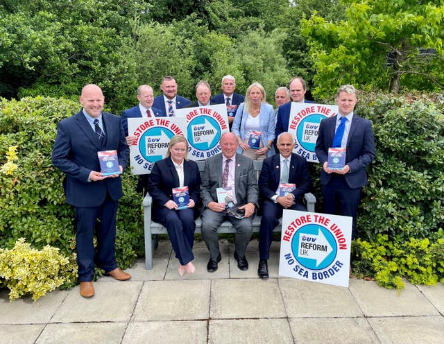 Reform UK deputy leader Ben Habib (on the bench, right) and TUV leader Jim Allister (on the bench centre) with parliamentary election candidates at the TUV manifesto launch at Dunsilly Hotel in Co Antrim