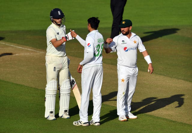 England's Joe Root and Pakistan's Mohammad Abbas fist bump after the second Test ends in a draw