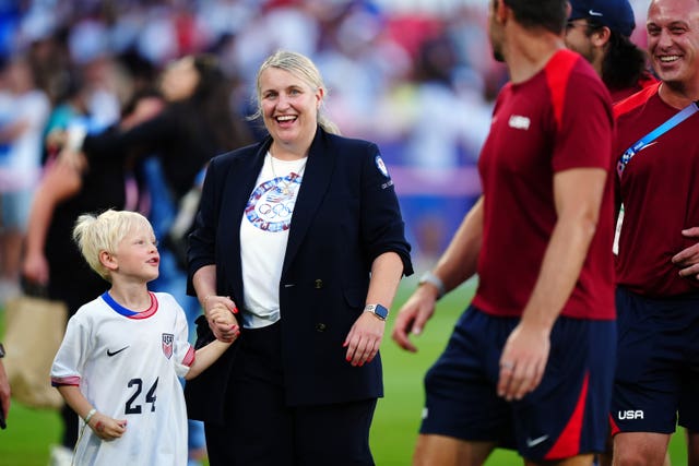 Emma Hayes, holding her son's hand, at the Paris 2024 Olympics