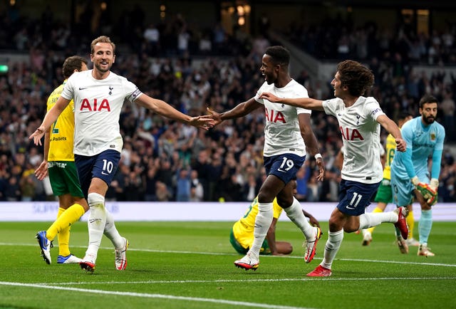 Harry Kane (left) celebrates scoring