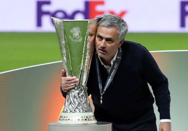 Then Manchester United manager Jose Mourinho poses with the trophy after winning the Europa League Final against Ajax