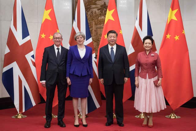 Theresa May and her husband Philip pose for a photograph with Chinese President Xi Jinping and his wife Peng Liyuan at the Diaoyutai State Guest House in Beijing during her visit to China (Stefan Rousseau/PA)