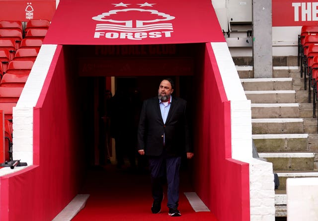 Evangelos Marinakis walks out of the pitchside tunnel at the City Ground