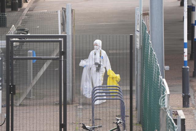 A forensic investigator at Huntingdon train station in Cambridgeshire
