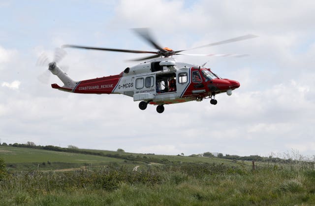 An HM Coastguard helicopter just off the ground