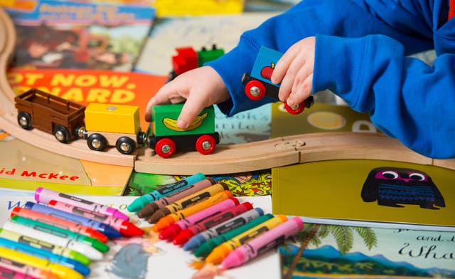Toddler playing with train
