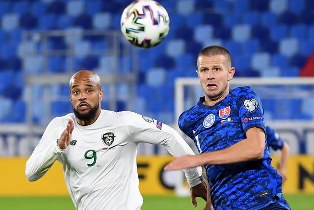 Republic of Ireland striker David McGoldrick (left) battles Slovakia's Denis Vavro