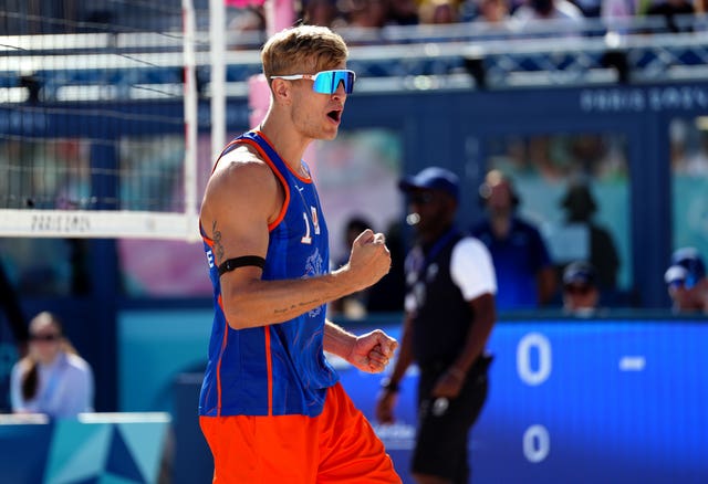 Steven van de Velde pumps his fist as he prepares for his first game against Italy at the beach volleyball.