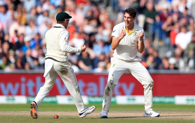 Pat Cummins celebrates what he thought was his five-wicket haul - but DRS saved Craig Overton 