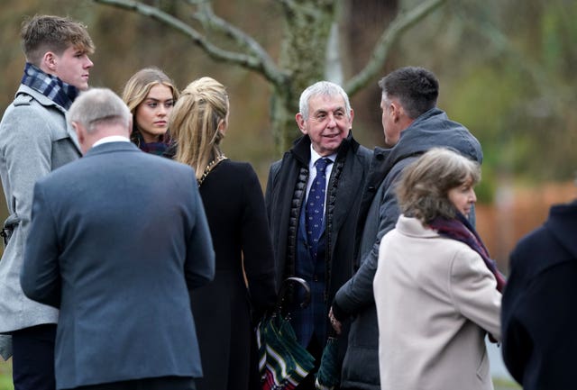 Ian McGeechan (right) speaks to Kenny Logan, Gabby Logan and family before the memorial service