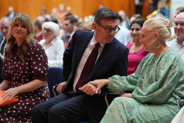 Andy Burnham speaking with his wife Marie-France van Heel ahead of being confirmed as the new leader of the Labour Party at a special conference held at the Trades Union Congress, in central London, on July 17