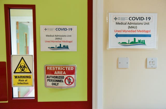 Signage on the Covid-19 ward at the Neath Port Talbot Hospital, in Wales (Jacob King/PA)