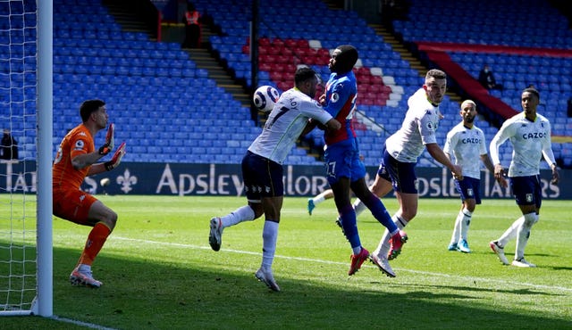 Tyrick Mitchell, centre, bundles home Crystal Palace's winner