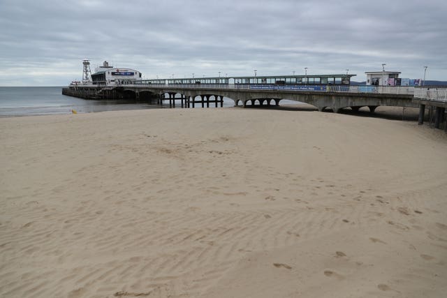An empty beach and pier at Bournemouth in Dorset
