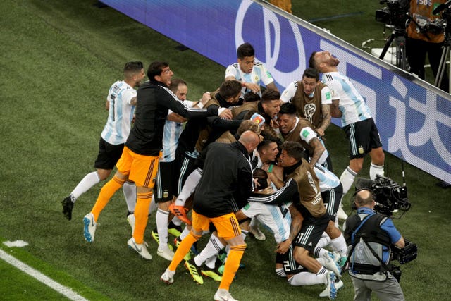 Argentina''s players celebrate Marcos Rojo''s winner (Owen Humphreys/PA)