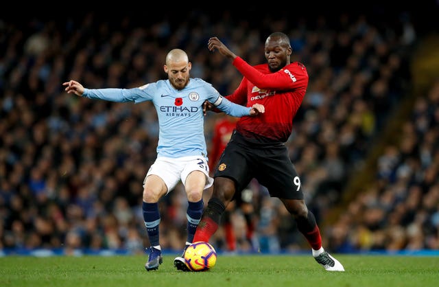 Manchester City’s David Silva (left) and Manchester United’s Romelu Lukaku (right) battle for the ball