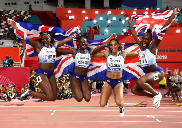 Asha Philip, Dina Asher-Smith, Ashleigh Nelson and Daryll Neita celebrate their 4x100m relay silver