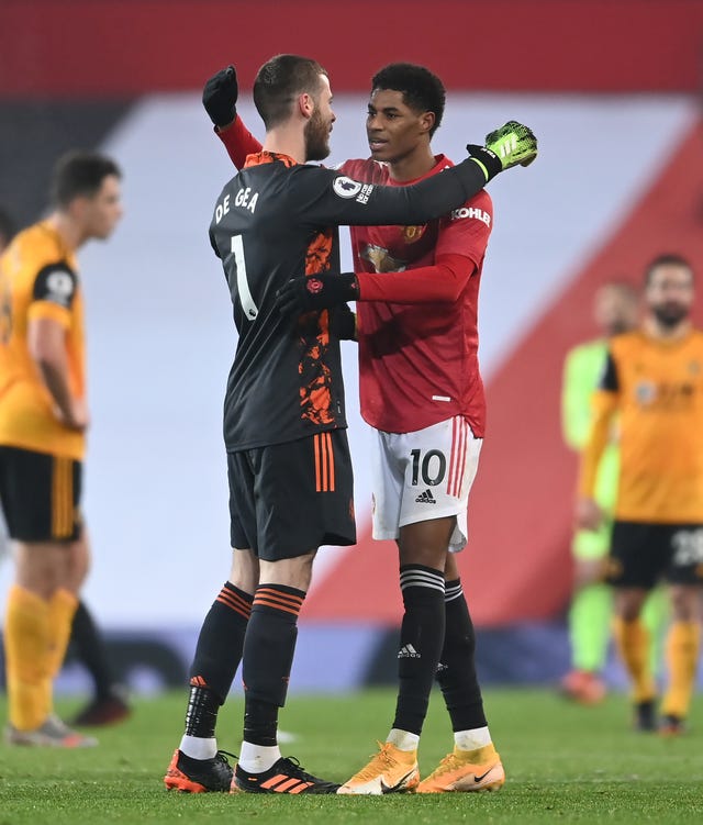 David De Gea hugs Marcus Rashford after his late winner on Tuesday