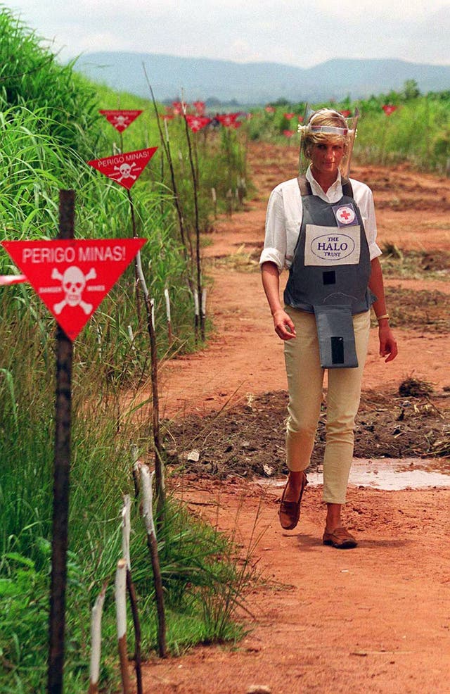 Diana tours a minefield in body armour to see for herself the carnage mines cause, during her visit to Angola