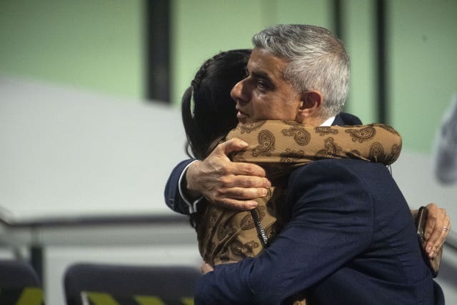 Labour’s Sadiq Khan is hugged by one of his daughters after he was re-elected as Mayor of London (Victoria Jones/PA)