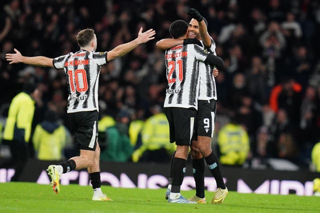 Mikael Mandron, right, embraces team-mates