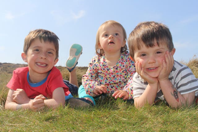 Sam Tuckett (right), with his brother Osca, six, and sister Ella, one