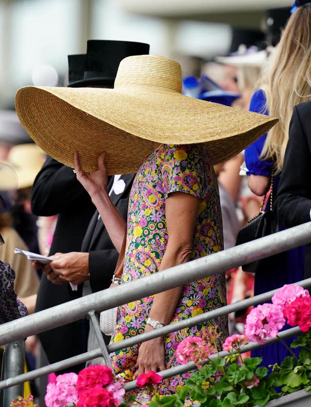 Not too sure how much of the action this racegoer could see though!