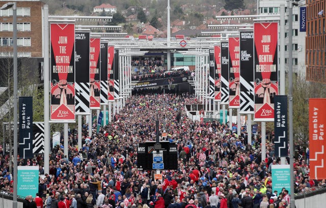 Fans arrive at Wembley for the Checkatrade Trophy final