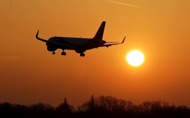 A plane lands during sunrise at London Gatwick Airport