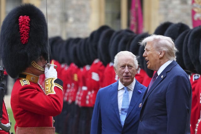 The King and Mr Trump reviewing the guard of honour during a ceremonial welcome at Windsor Castle