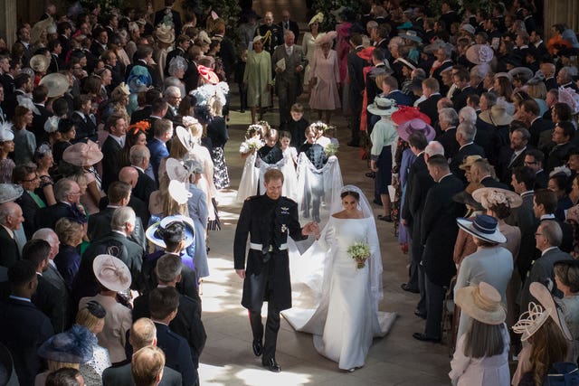 Prince Harry and Meghan Markle leave St George’s Chapel at Windsor Castle after their wedding