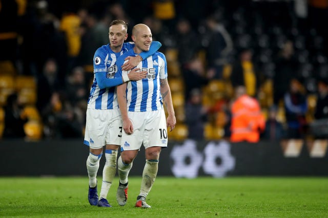 Florent Hadergjonaj (left) and Aaron Mooy celebrate at the final whistle