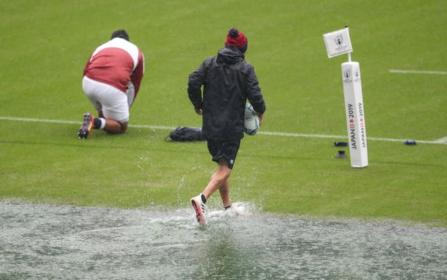 England coach Eddie Jones traipses over water during the captain's run