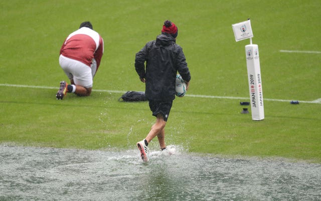 England coach Eddie Jones traipses over water during the captain’s run
