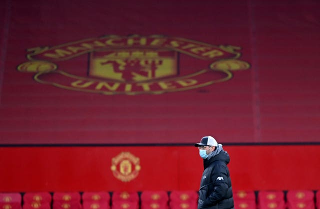 Liverpool manager Jurgen Klopp in front of the Manchester United crest at Old Trafford