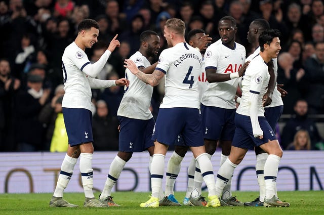 Dele Alli, left, celebrates his second goal with team-mates